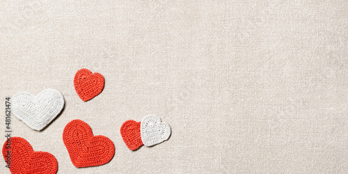 Bilde på lerret Valentines day background, knit hearts valentine, handmade red crochet heart on sackcloth table, diy gift for romance holiday, symbol of love