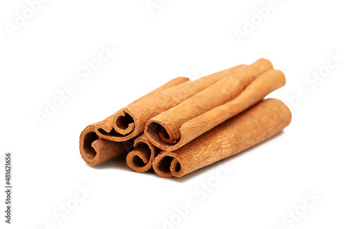 Close up of cinnamon sticks on white background