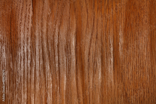 Texture of wood veneer with bulges and cracks.