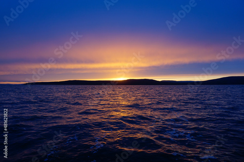 Fiery sunset over the water in the Tatar Strait