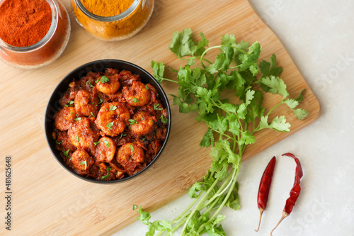 Top view spicy hot Prawn roast shrimp fry masala fish curry. Indian food fish fry red fish curry Asian cuisine Kerala fish curry South Indian Bengali  Goan fish curry Grilled tiger shrimps Sri Lanka
