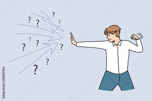 Business challenge and defending concept. Young confident businessman standing and defending from doubts and risks dangers vector illustration 