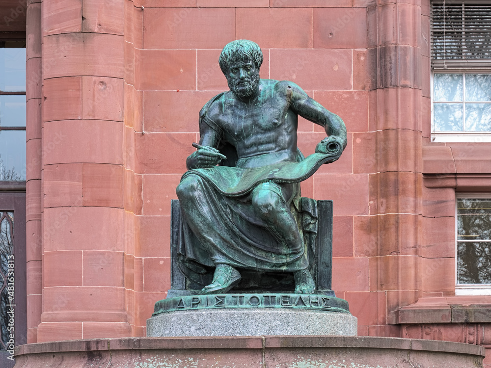 Freiburg im Breisgau, Germany. Aristotle Statue in front of the main building of the Albert Ludwig University of Freiburg. The statue was erected in 1921. Greek text on plinth means Aristotle.