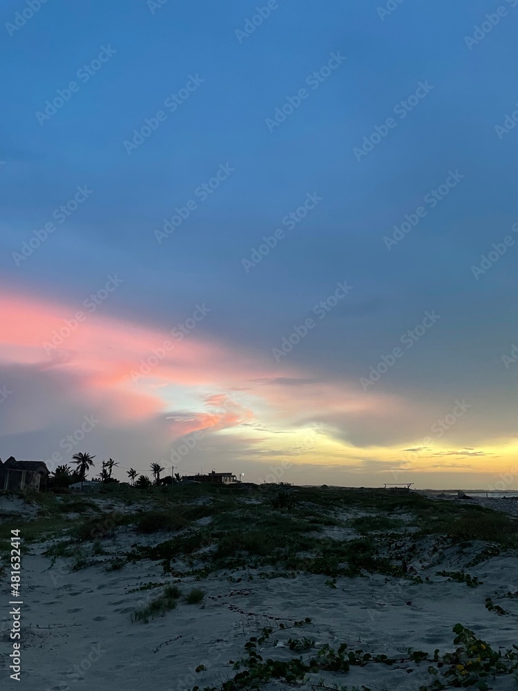 Obraz premium Sunset in North Colombia with Palms and colorful sky