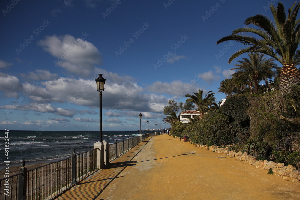 empty sand promenade along the sea