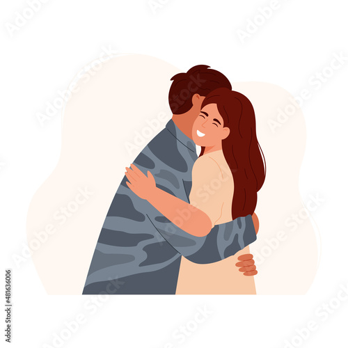 Happy woman embracing soldier after returning home. Military man or soldier dressed in camouflage uniform hugging wife. Long-awaited meeting. Couple reunion.