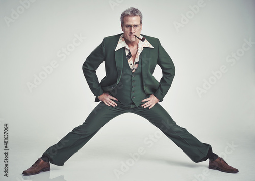 фотографія Groovy kinda guy. A mid-adult doing the splits in the studio.