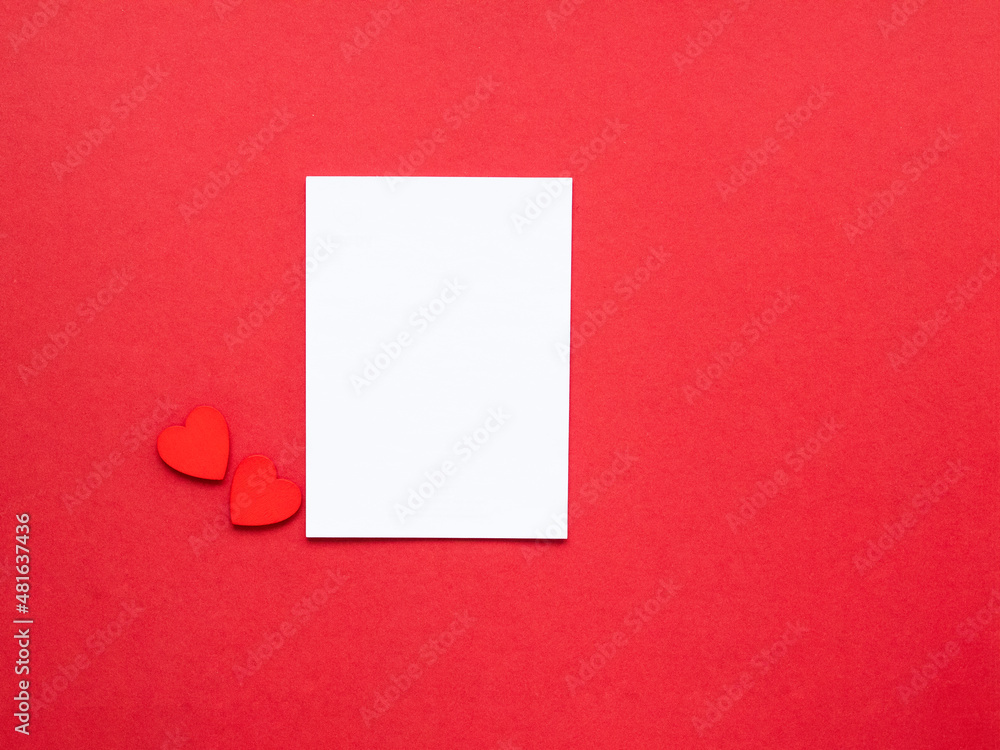 blank white paper and red hearts on redbackground. love background. Valentine's day concept blank white paper and red hearts on redbackground. love background. Valentine's day concept