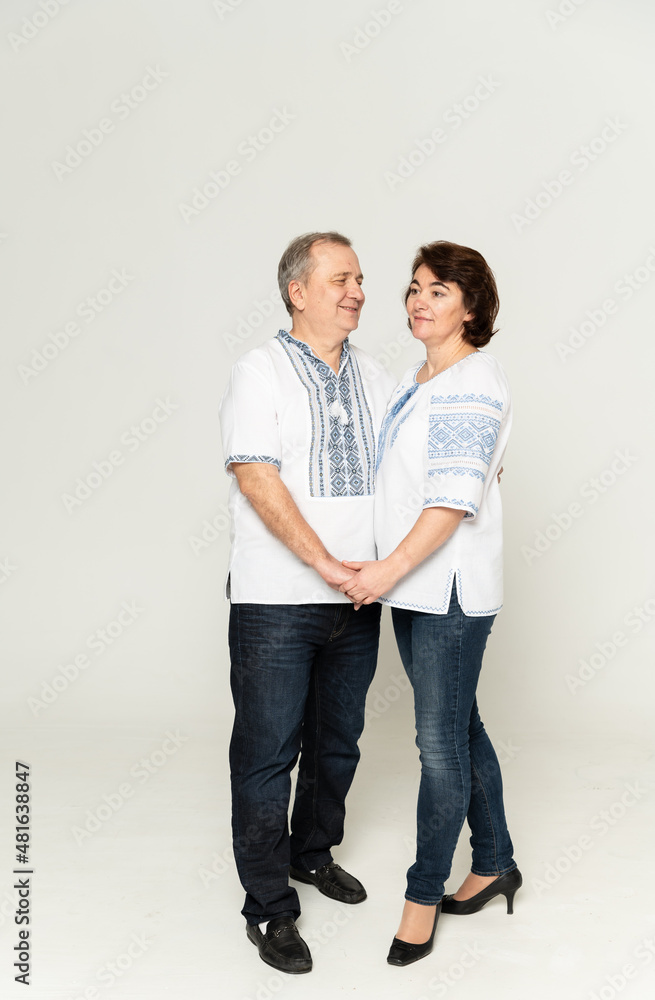 couple in embroidered shirts on a white background. people in national clothes of Ukraine on a white background. couple in embroidered shirts on a white background. people in national clothes of Ukraine on a white background.