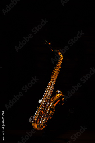 Tenor saxophone on a black background