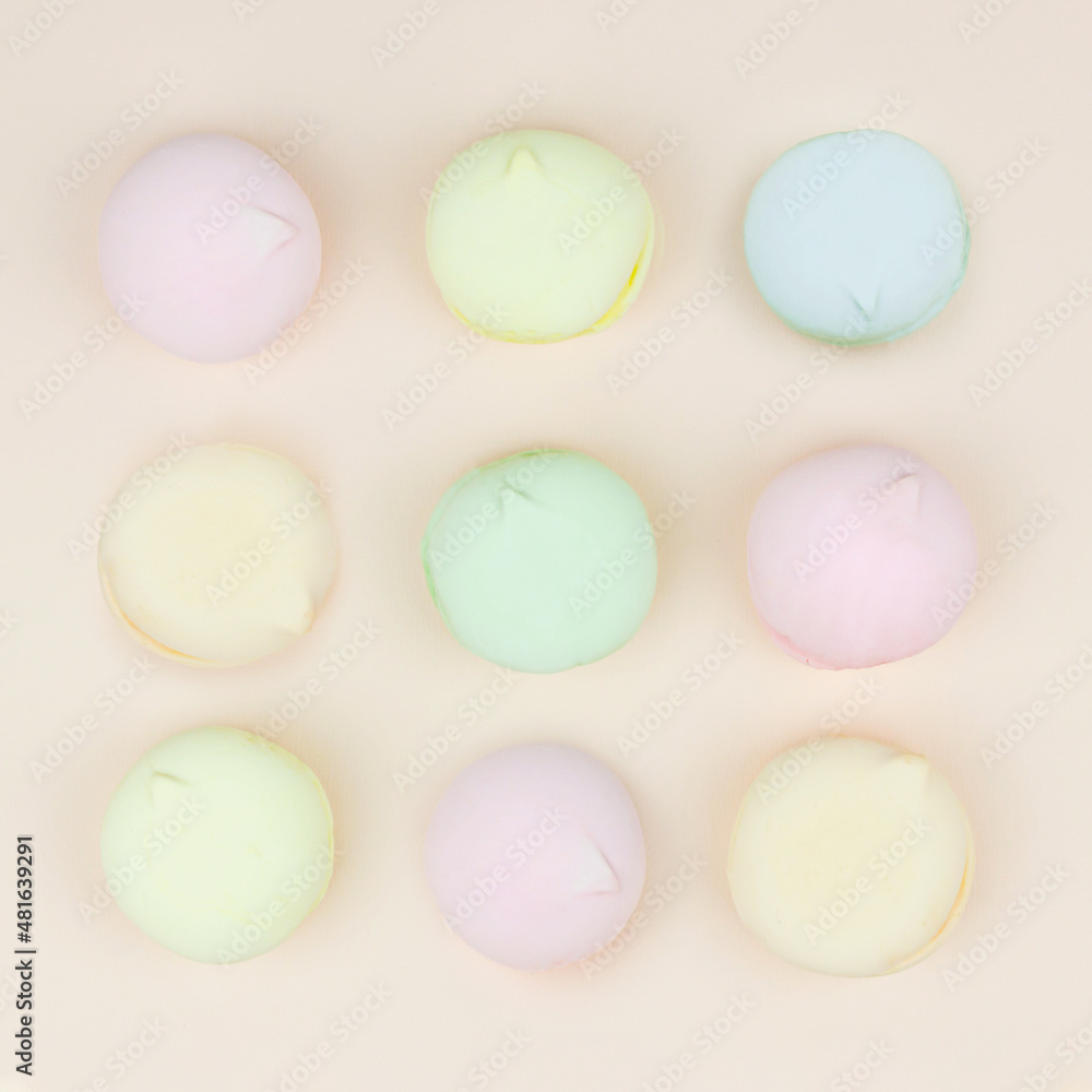 Marshmallows macaroons flat lay photo in minimal style. Top view, sweets and candy concept. Marshmallows macaroons flat lay photo in minimal style. Top view, sweets and candy concept.