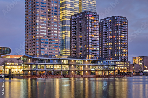 Rotterdam, The Netherlands, January 20, 2022: Rijnhaven harbour with the Floating Office and the Wilhelminapier highrise during the blue hour in the morning