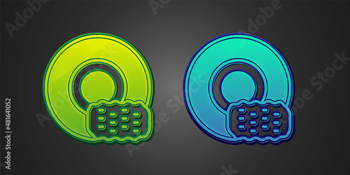 Green and blue Washing dishes icon isolated on black background. Cleaning dishes icon. Dishwasher sign. Clean tableware sign. Vector