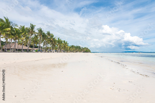 The shoreline of scenic Dumaluan Beach in Panglao, Bohol. Low angle shot. photo