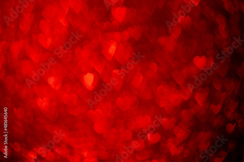 Red hearts, sparkling glitter bokeh background, valentines day abstract defocused texture