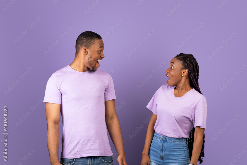 Portrait of excited young black couple hearing great news Portrait of excited young black couple hearing great news