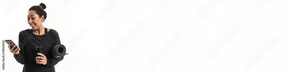 Cheerful african american woman using cellphone Cheerful african american woman using cellphone