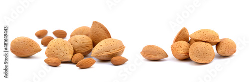 Heap of fresh almonds in shells isolated on white background