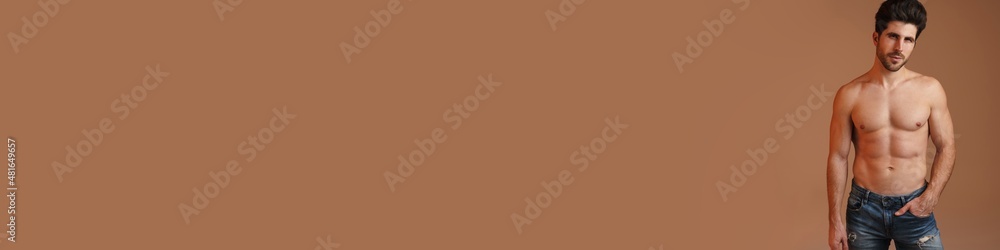 Fototapeta premium Shirtless masculine man posing and looking at camera