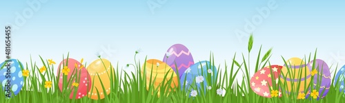 Cartoon easter eggs on meadow green grass seamless border. Spring lawn with painted egg and flowers. Happy easter day hunt vector background