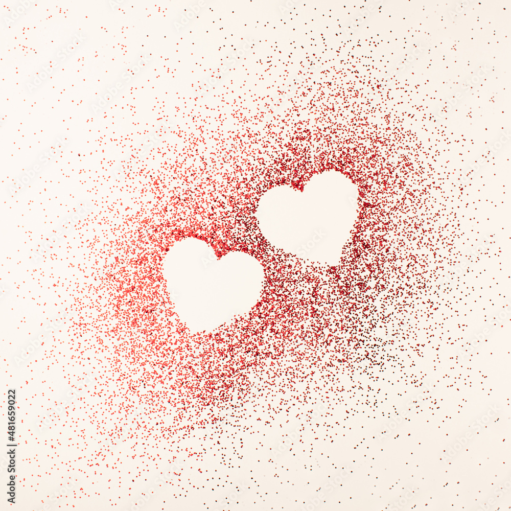 Creative idea of two hearts made of red shiny glitter on bright background. Minimal Valentine's day, birthday or best friend forever concept. Creative idea of two hearts made of red shiny glitter on bright background. Minimal Valentine's day, birthday or best friend forever concept.