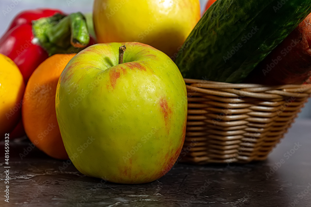 Assorted organic vegetables and fruits in a wicker basket Assorted organic vegetables and fruits in a wicker basket