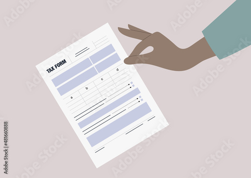 A tax return form template, a hand holding a blank document, annual financial report