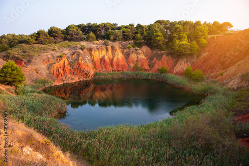 Colorful bauxite quarry lake in Apulia, Italy