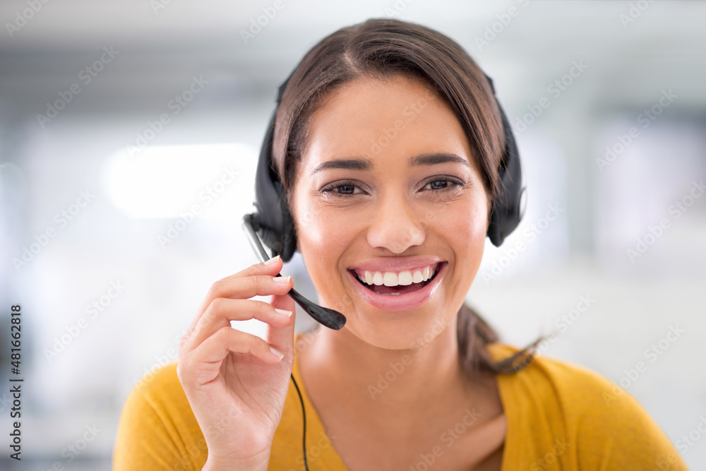 She's eager to assist you. Portrait of an attractive young customer service representative wearing a headset. She's eager to assist you. Portrait of an attractive young customer service representative wearing a headset.
