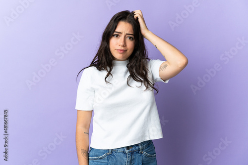 Young caucasian woman isolated on purple background with an expression of frustration and not understanding