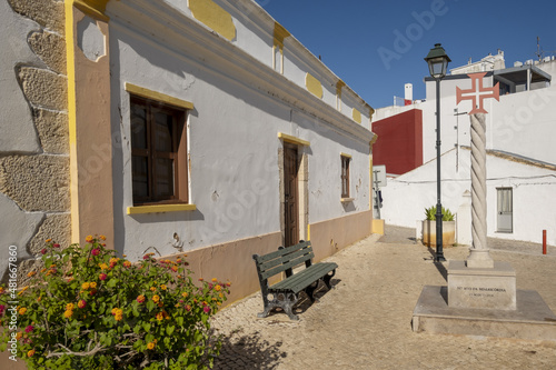 granit cross in a square of Alvor, Prtugal photo