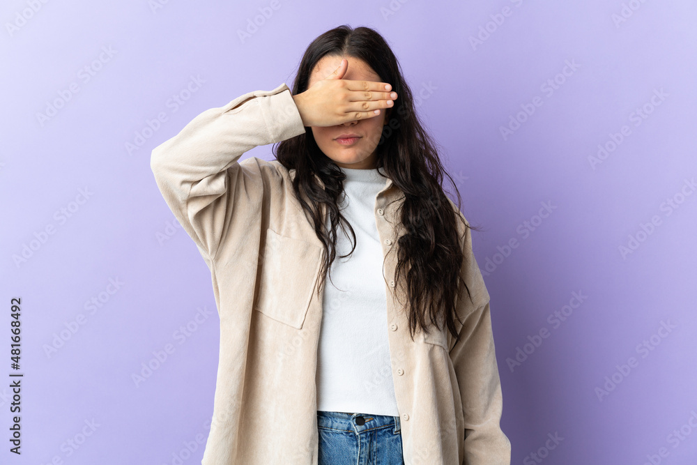 Young caucasian woman isolated on purple background covering eyes by hands. Do not want to see something Young caucasian woman isolated on purple background covering eyes by hands. Do not want to see something