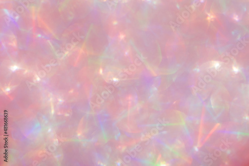 Abstract defocused pink background with shining glitter.Good as overlay layer.