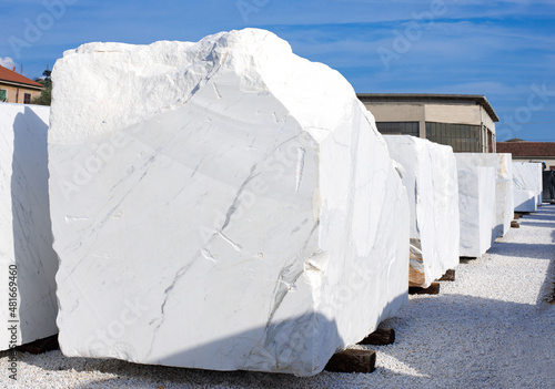 White marble blocks. Depot of marble factory, work stone in Italy. Selective focus.