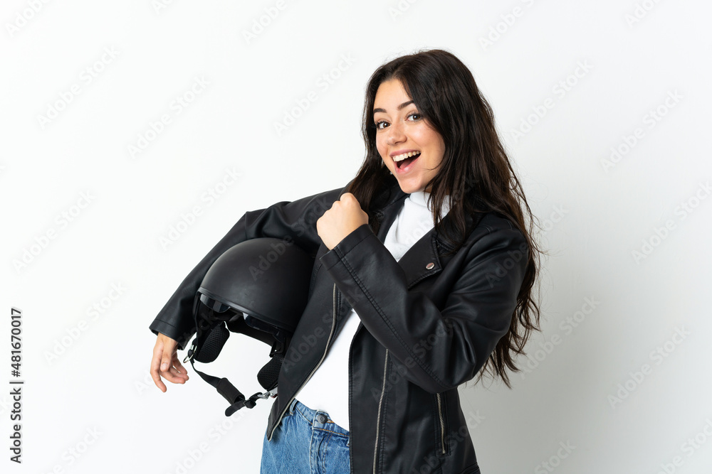 Woman holding a motorcycle helmet isolated on white background celebrating a victory Woman holding a motorcycle helmet isolated on white background celebrating a victory