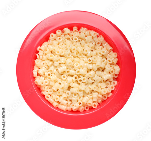 Red bowl with tasty pasta on white background, top view