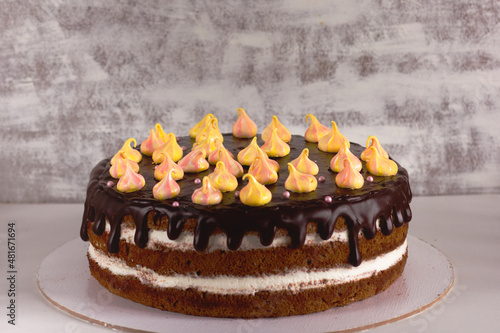 Canvas Print Homemade baked chocolate cake with white cream and chocolate drops decorated by