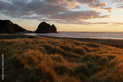 sunset on the beach In Auckland New Zealand Piha Beach