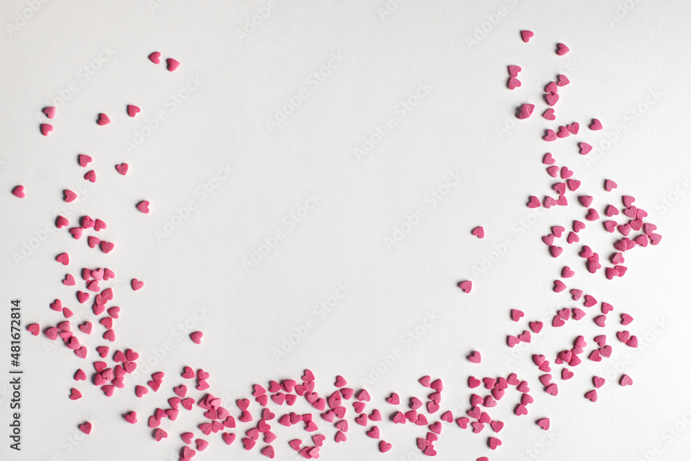 Pink candy hearts on white background