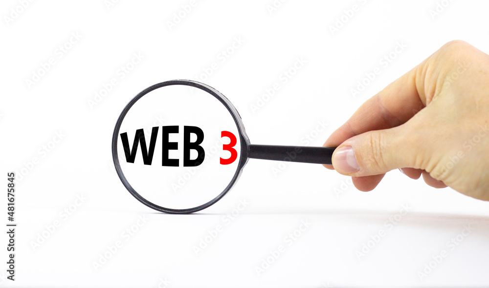 WEB 3 symbol. Concept words WEB 3. Magnifying glass. Beautiful white table, white background. Businessman hand. Copy space. Business, technology and WEB 3.0 web3 concept. WEB 3 symbol. Concept words WEB 3. Magnifying glass. Beautiful white table, white background. Businessman hand. Copy space. Business, technology and WEB 3.0 web3 concept.