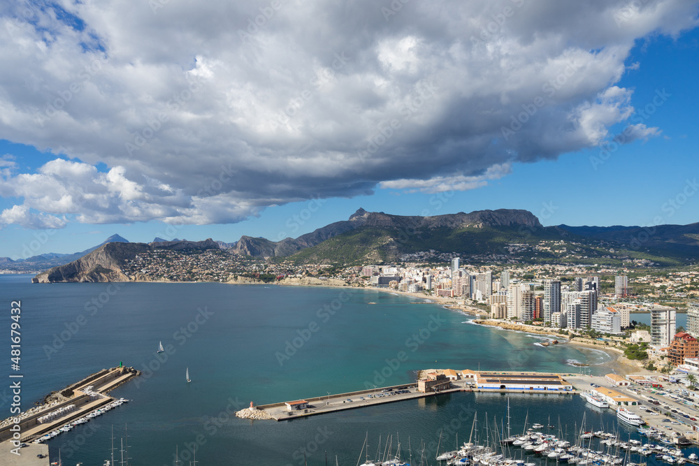 sailboats in the marina of Calpe and clouds on the Mediterranean coast in Spain