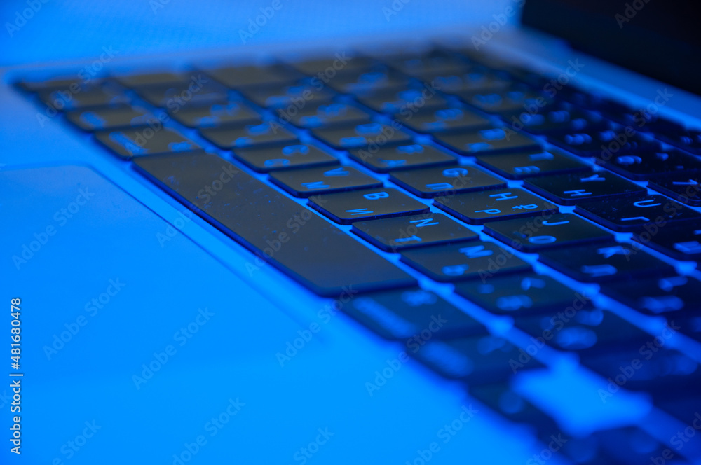 keyboard close-up with RGB backlight blurred background