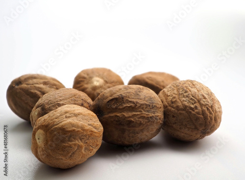 Several nutmegs on a white background