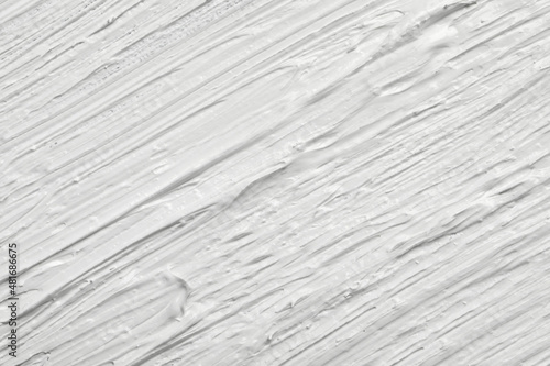 Strokes of white oil paint as background, closeup