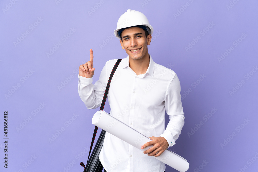 Young architect man isolated on background pointing up a great idea Young architect man isolated on background pointing up a great idea
