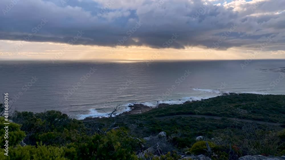 Timelapse of a storm coming in over the ocean at sunset Timelapse of a storm coming in over the ocean at sunset