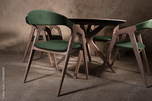 Beautiful brown wooden folding table on brown concrete background