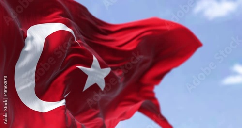 Detail of the national flag of Turkey waving in the wind on a clear day photo