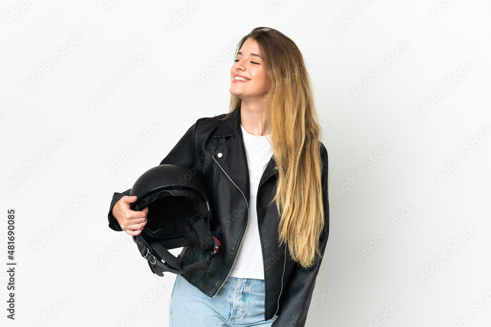 Woman holding a motorcycle helmet isolated on white background looking side Woman holding a motorcycle helmet isolated on white background looking side