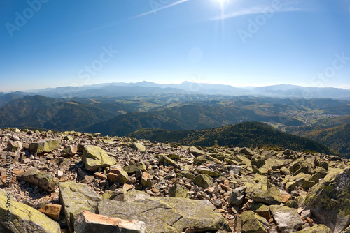 Rocky mountain hillside with big stone boulders on sunny day